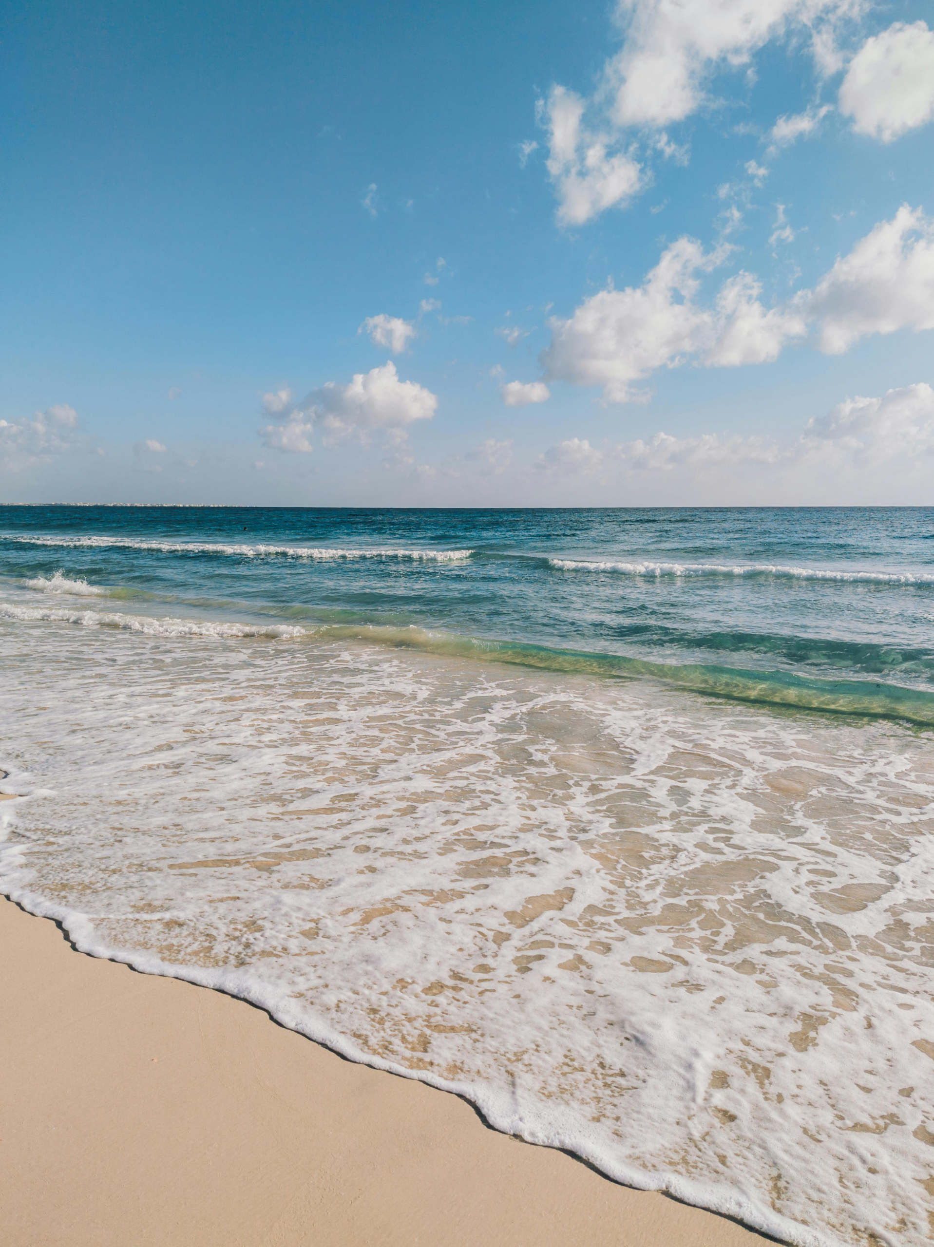 Gentle ocean waves and a soft horizon, symbolizing calm and grounding for anxiety therapy.